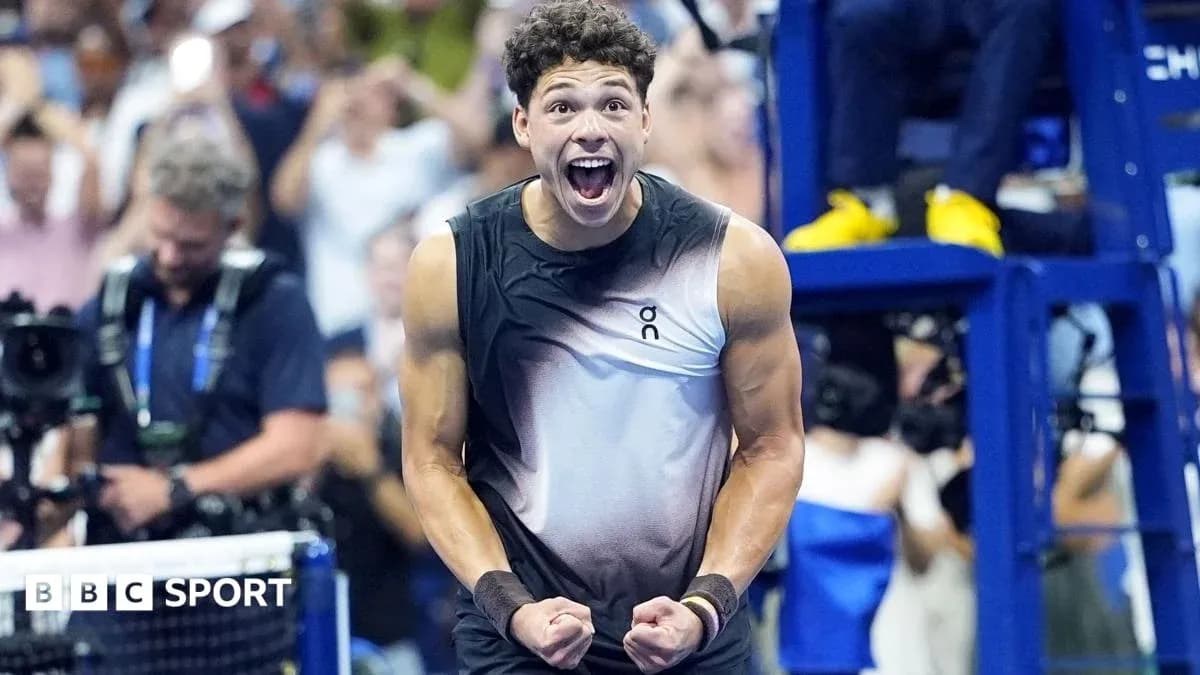 Tennis player celebrating victory with raised fists