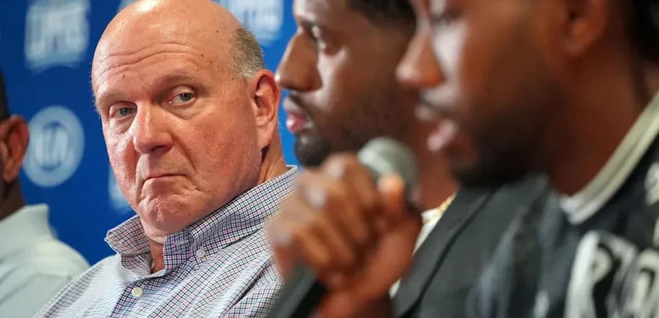 Steve Ballmer listening during a press conference