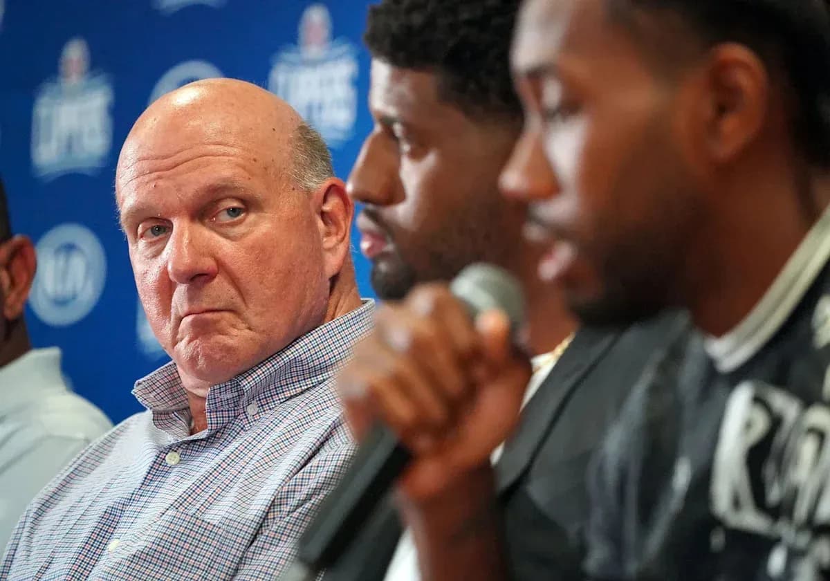 Steve Ballmer listening during a press conference