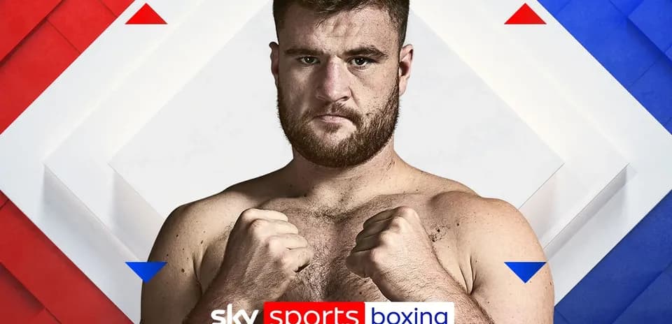 Boxer posing with clenched fists for promotion