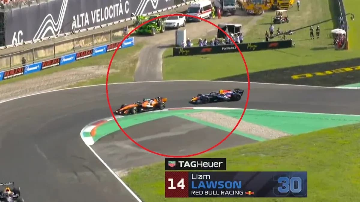 Two Formula 1 cars racing on track corner