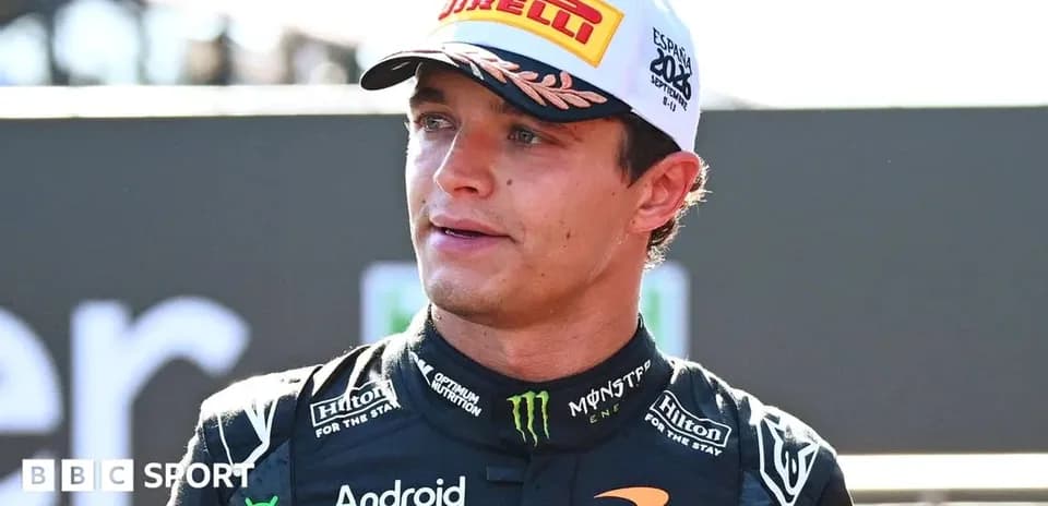 Driver wearing McLaren suit at race event