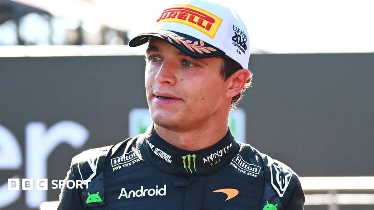 Driver wearing McLaren suit at race event