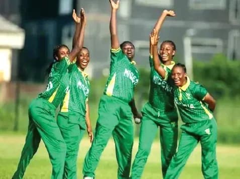 Five Nigerian cricketers celebrating on the field