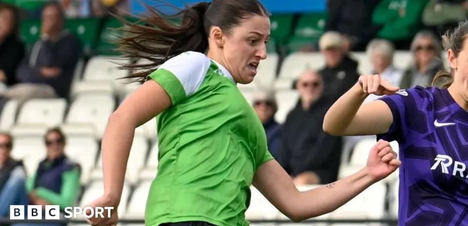 Player in green sprinting during a football match
