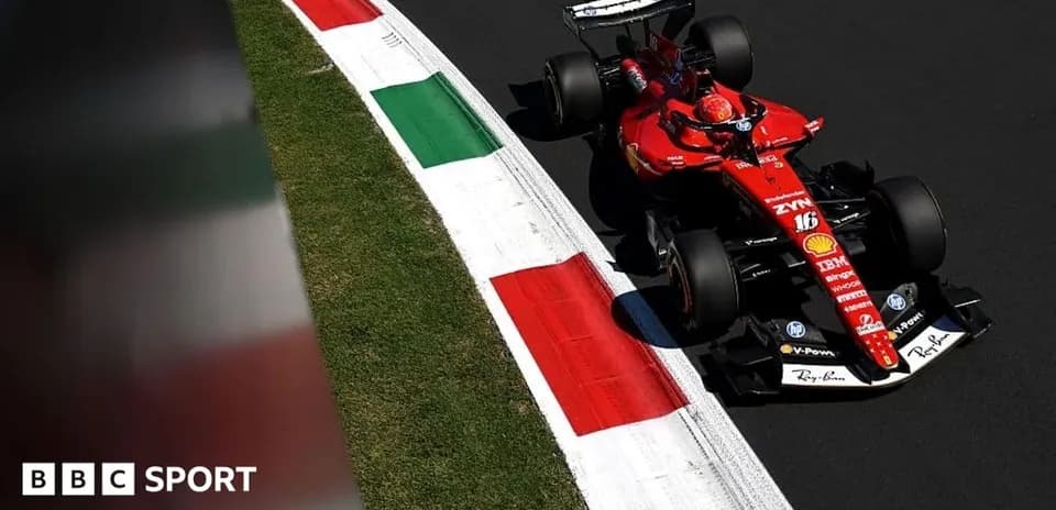 Ferrari F1 car navigating a corner on track