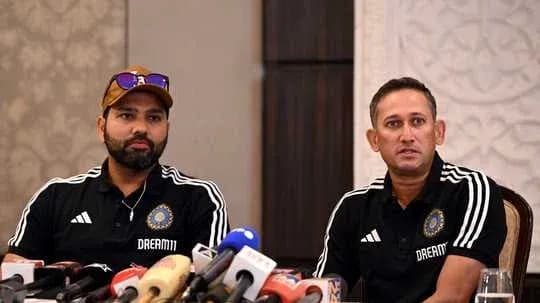 Rohit Sharma and coach at press conference table