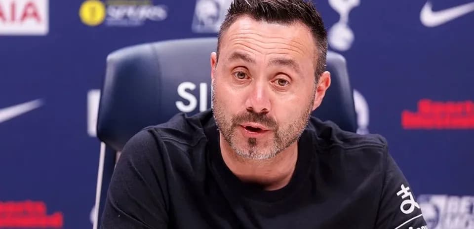Manager speaking at press conference table