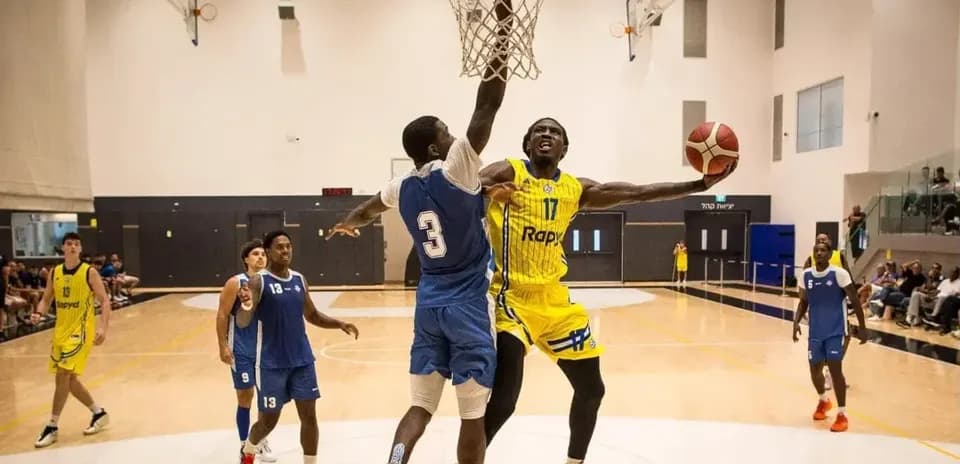 Player dunking the ball during basketball game