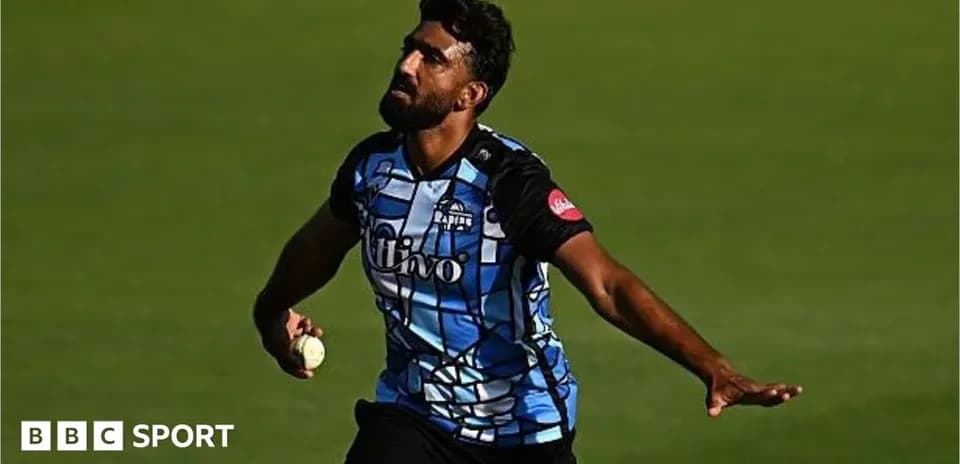 Bowler delivering a ball during cricket match