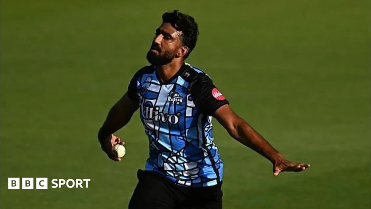 Bowler delivering a ball during cricket match