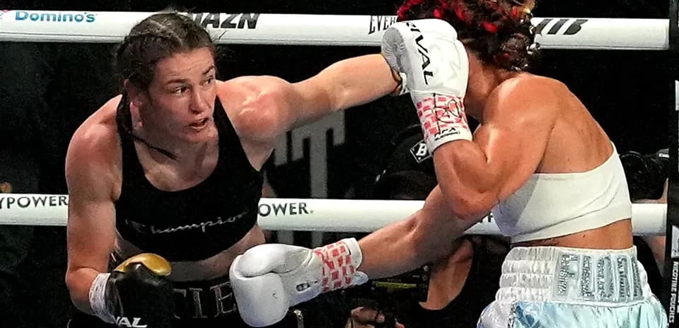 Boxers exchanging punches in the ring