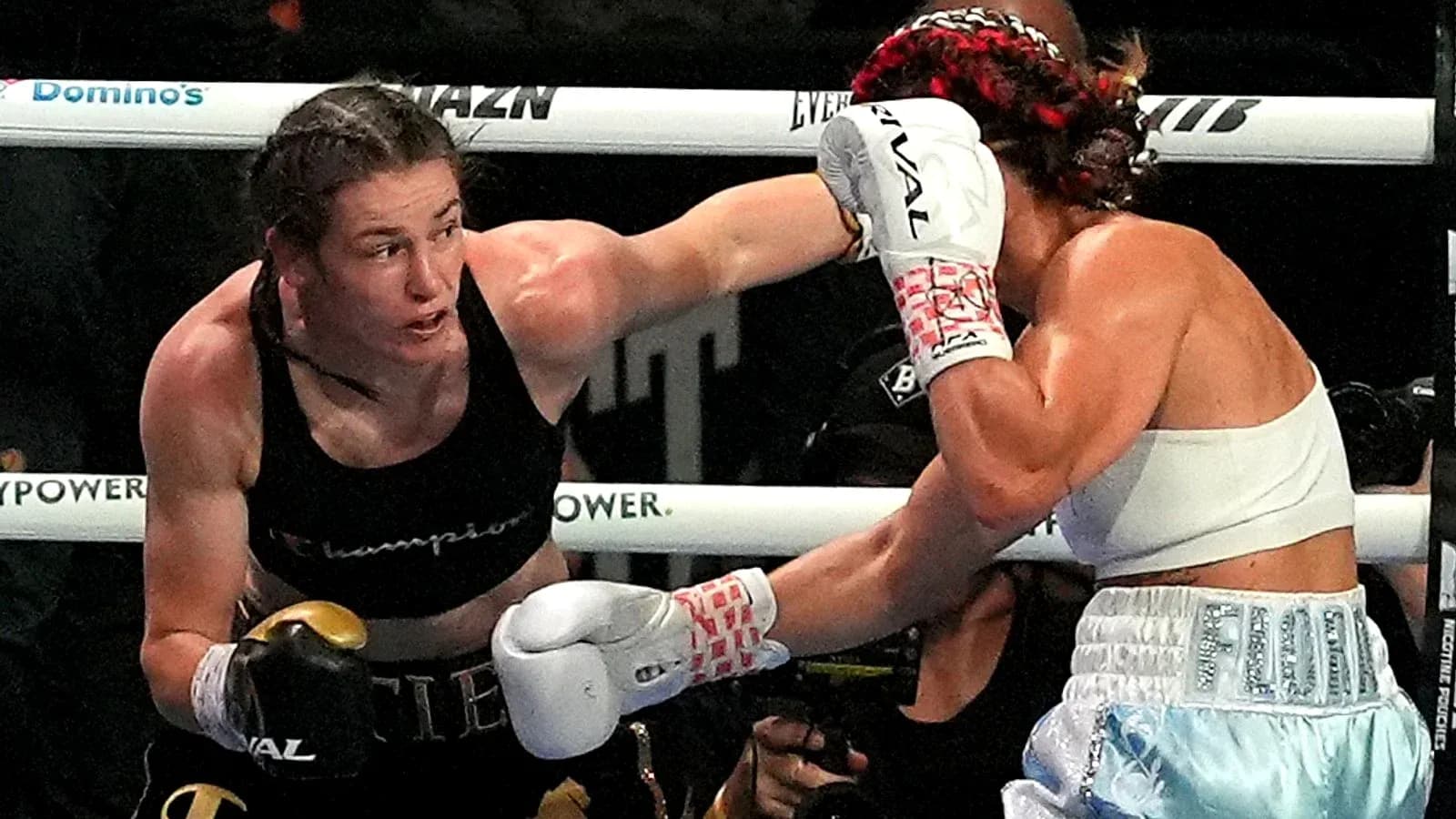 Boxers exchanging punches in the ring