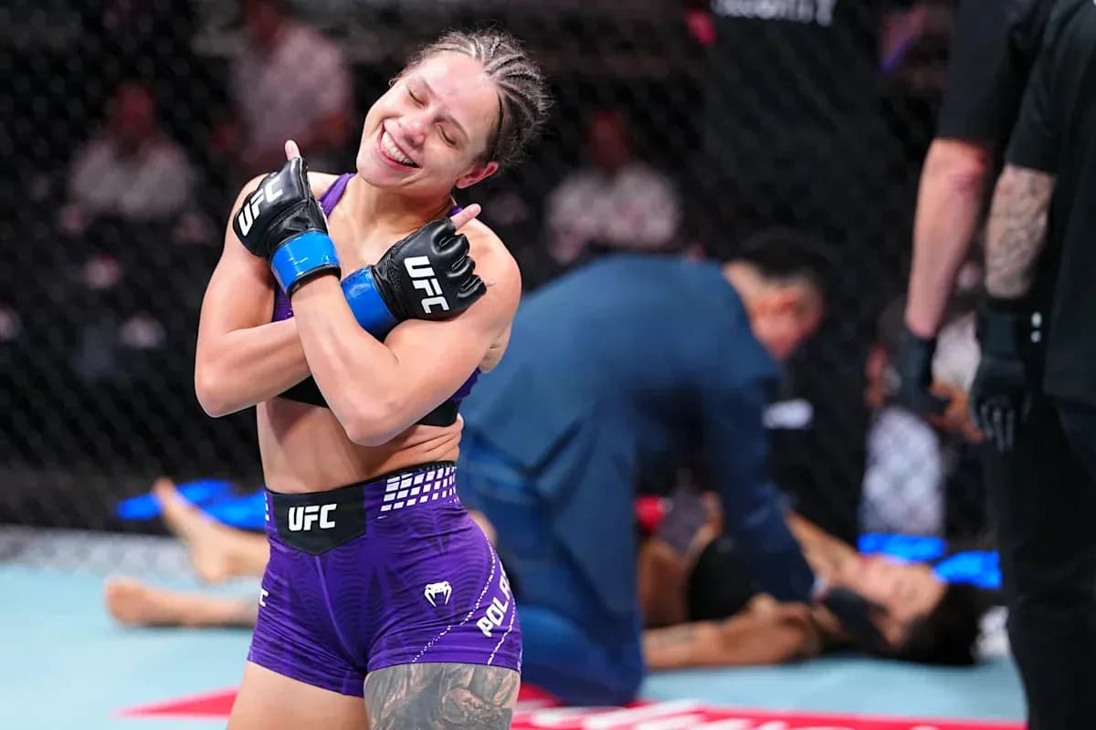 Fighter celebrating victory after match in octagon