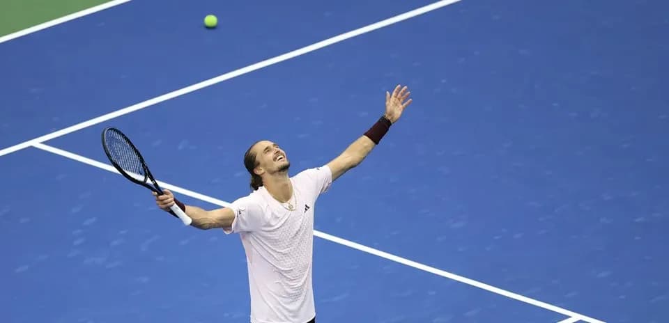 Player celebrating on the tennis court after winning point