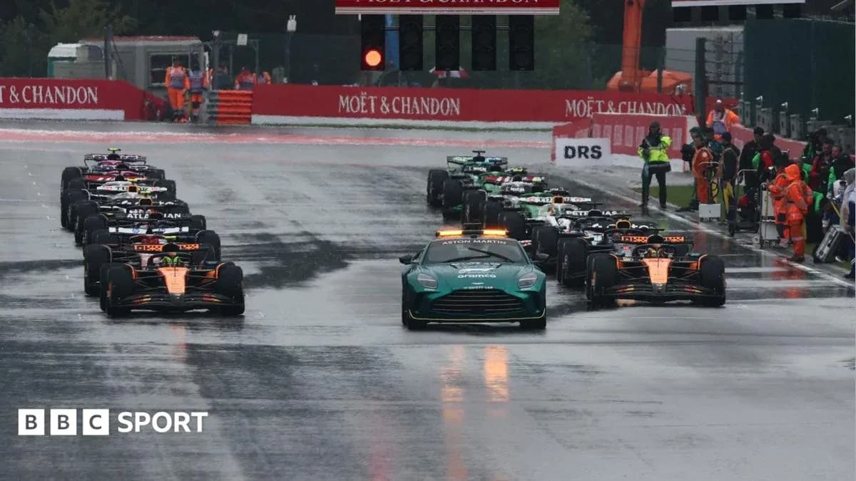 Cars lined up on wet track before Formula 1 race
