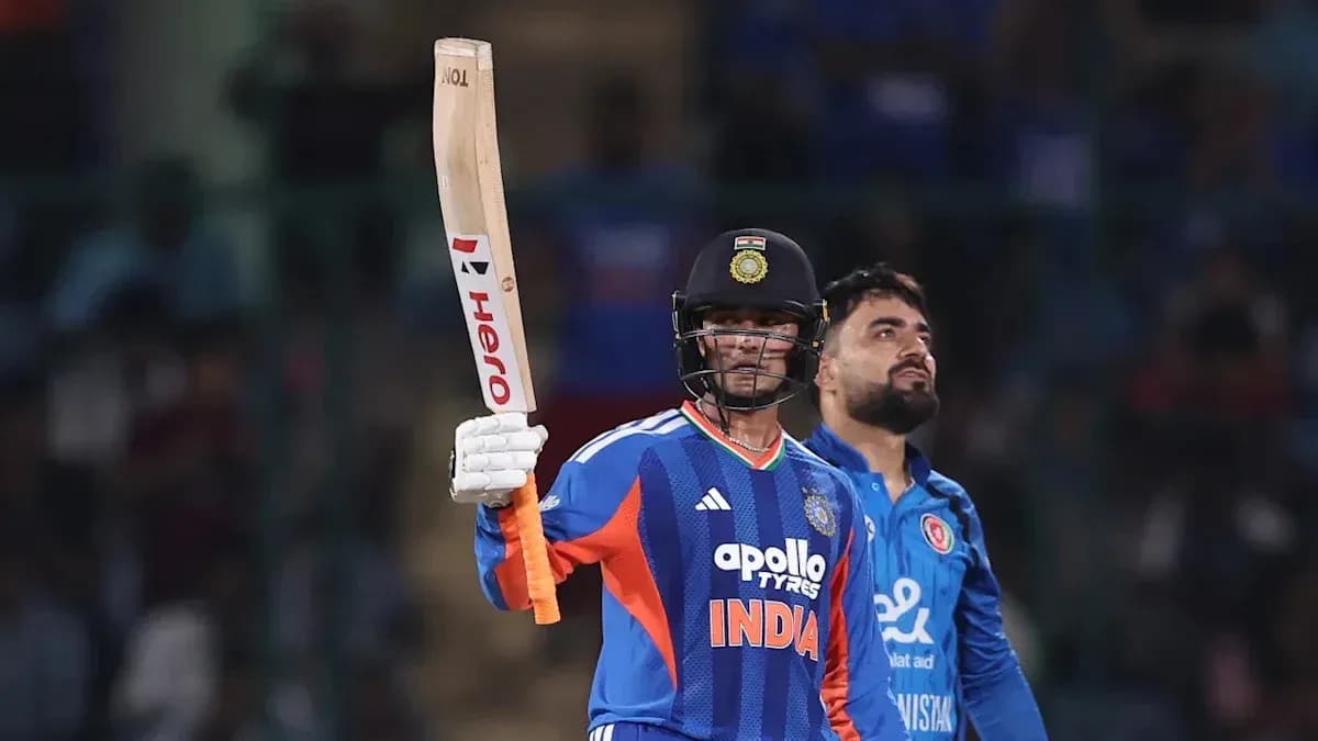 Batter celebrating with raised bat during match