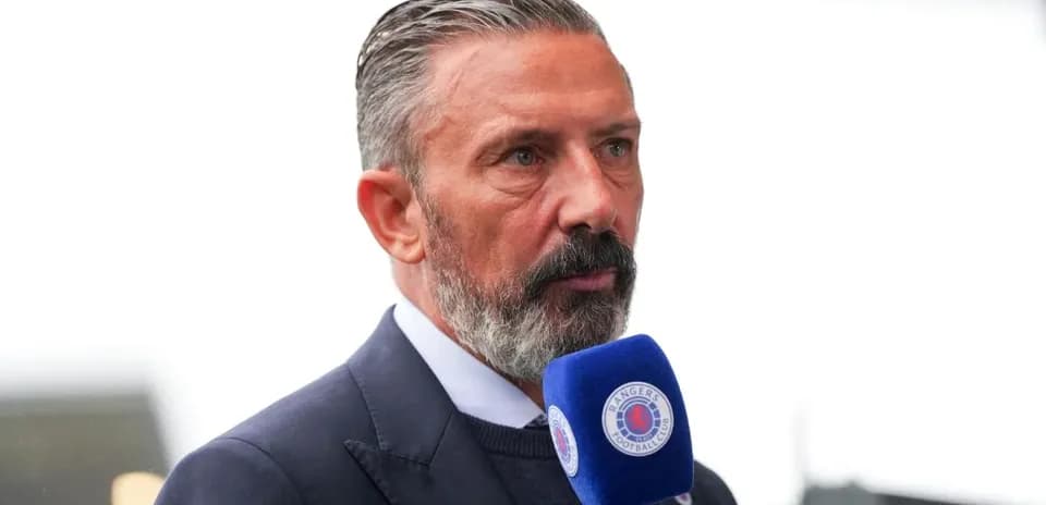 Presenter speaking into microphone during broadcast