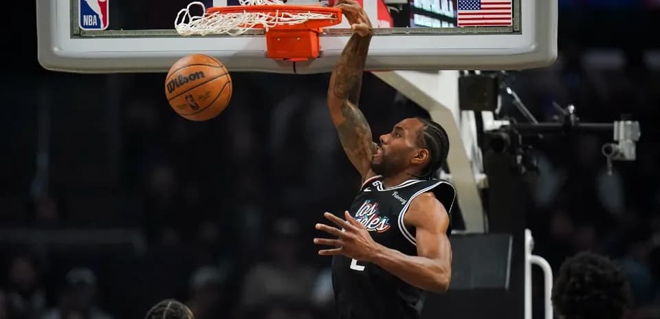 Player dunking a basketball during a game