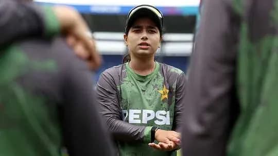 Player discussing strategy with teammates during practice Player discussing strategy with teammates during practice
