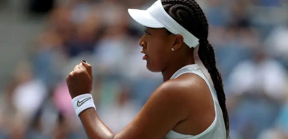 Tennis player celebrating with a raised fist