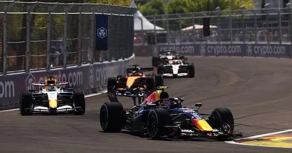 Formula 1 cars racing on a street circuit