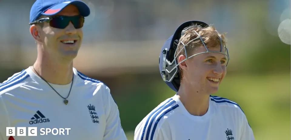 Two cricketers smiling during practice session