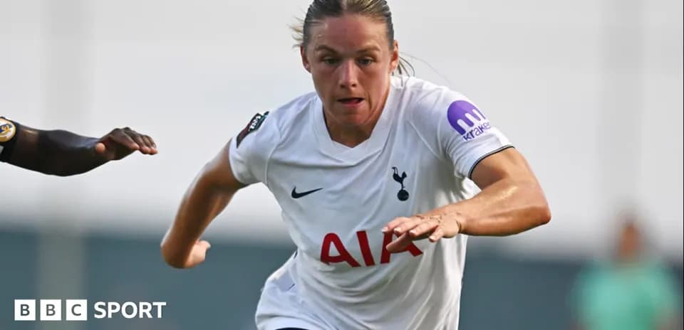 Player in Tottenham kit sprinting with opponent close behind
