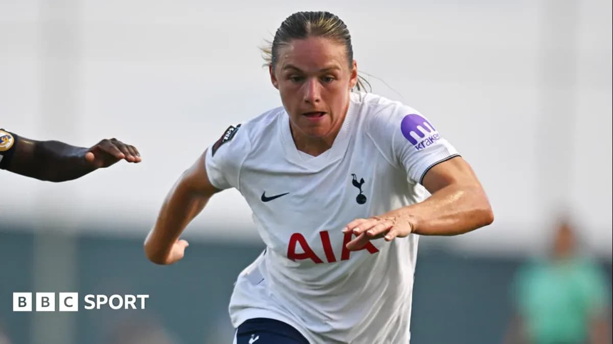 Player in Tottenham kit sprinting with opponent close behind