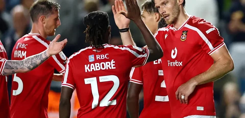 Players celebrating together after scoring a goal