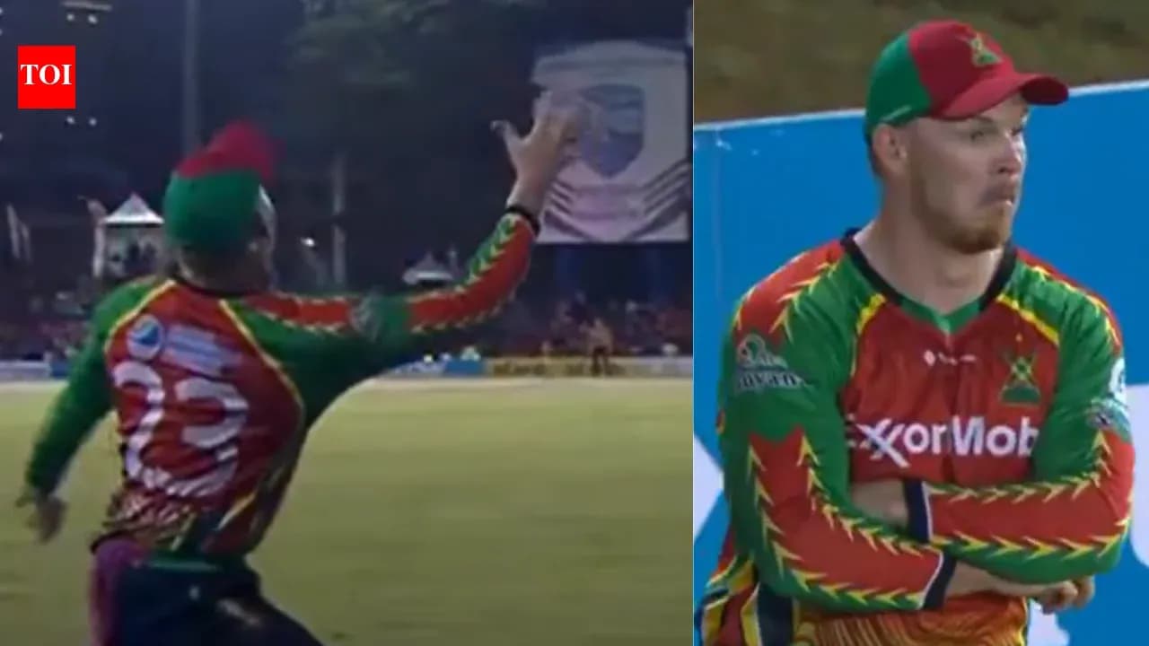 Player catching the ball during a cricket match
