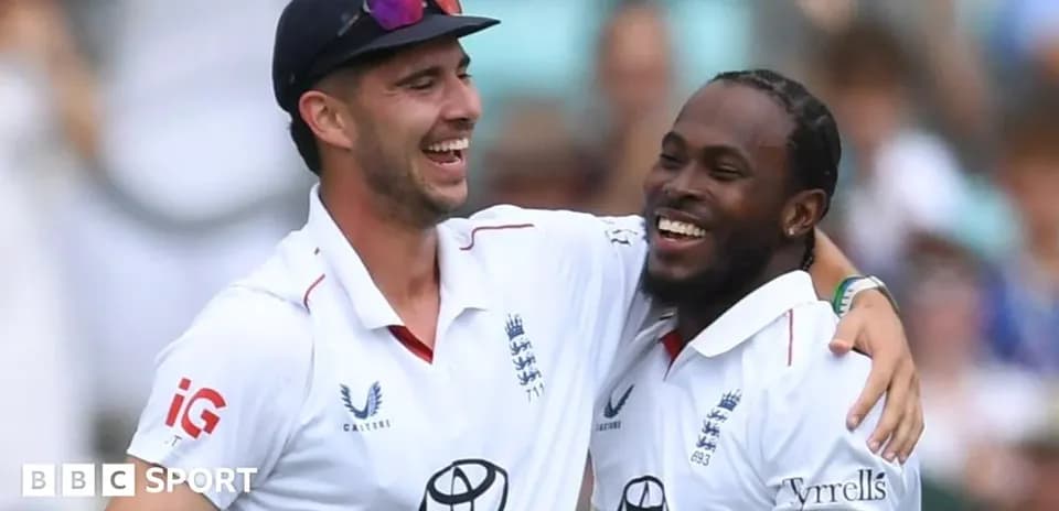 Two cricketers celebrating together on the field