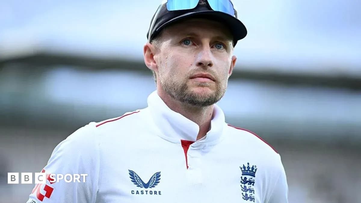 Cricketer in England jersey looking thoughtfully Cricketer in England jersey looking thoughtfully