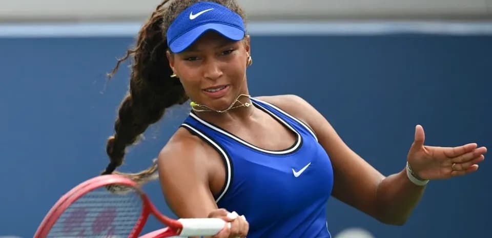 Tennis player preparing to hit a forehand shot