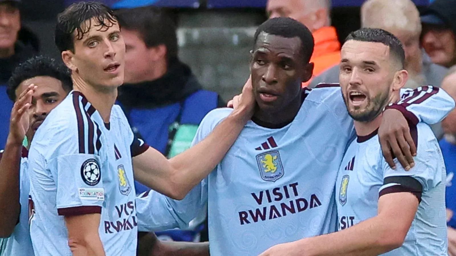 Three Aston Villa players celebrating a goal