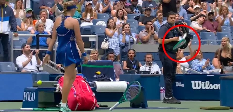 Player preparing to serve with crowd applauding