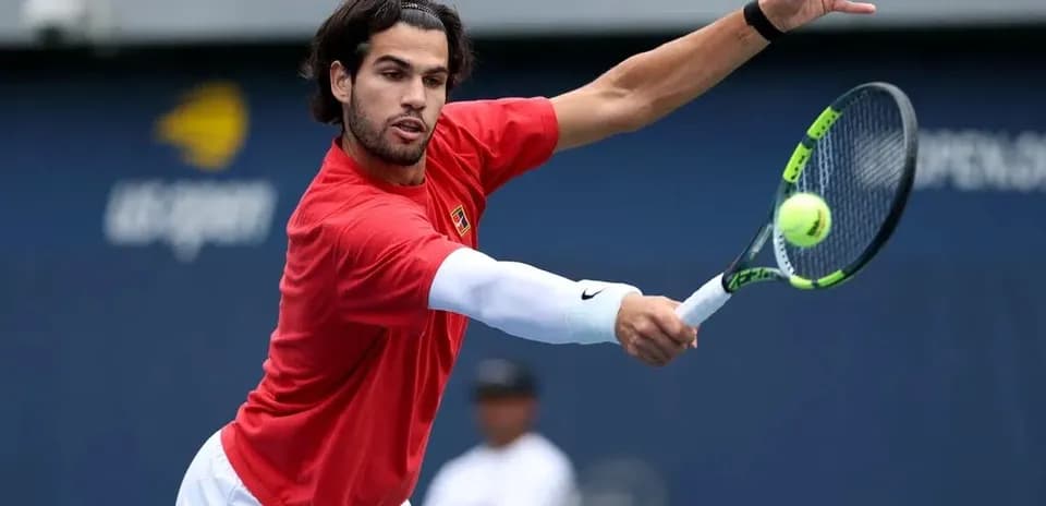 Tennis player hitting a forehand shot during practice