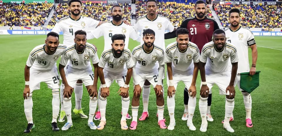 Football team posing for a group photo on field