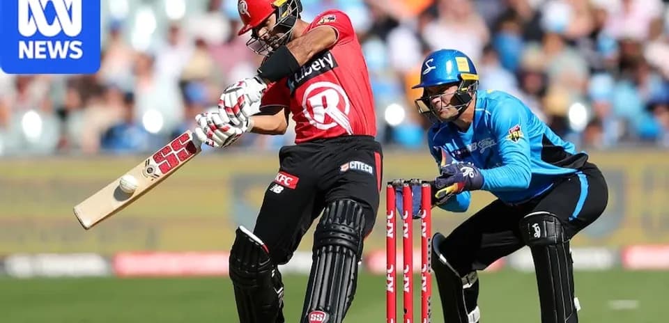Batsman playing a shot while wicketkeeper crouches