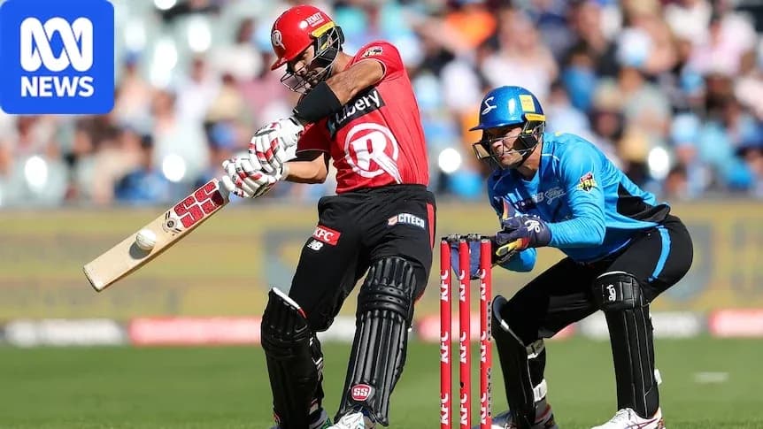 Batsman playing a shot while wicketkeeper crouches