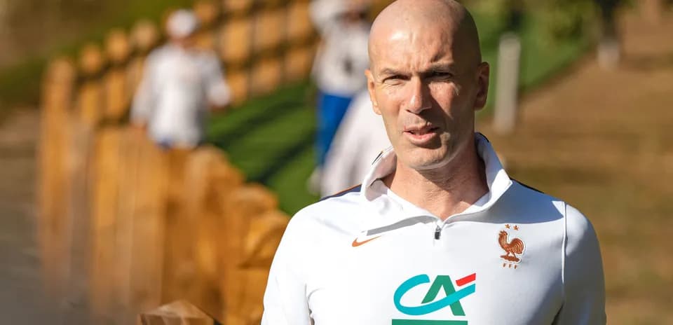 Zinedine Zidane walking near training facility