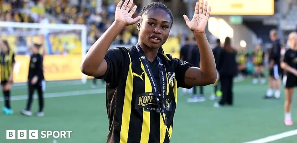 Player waving with hands on the pitch