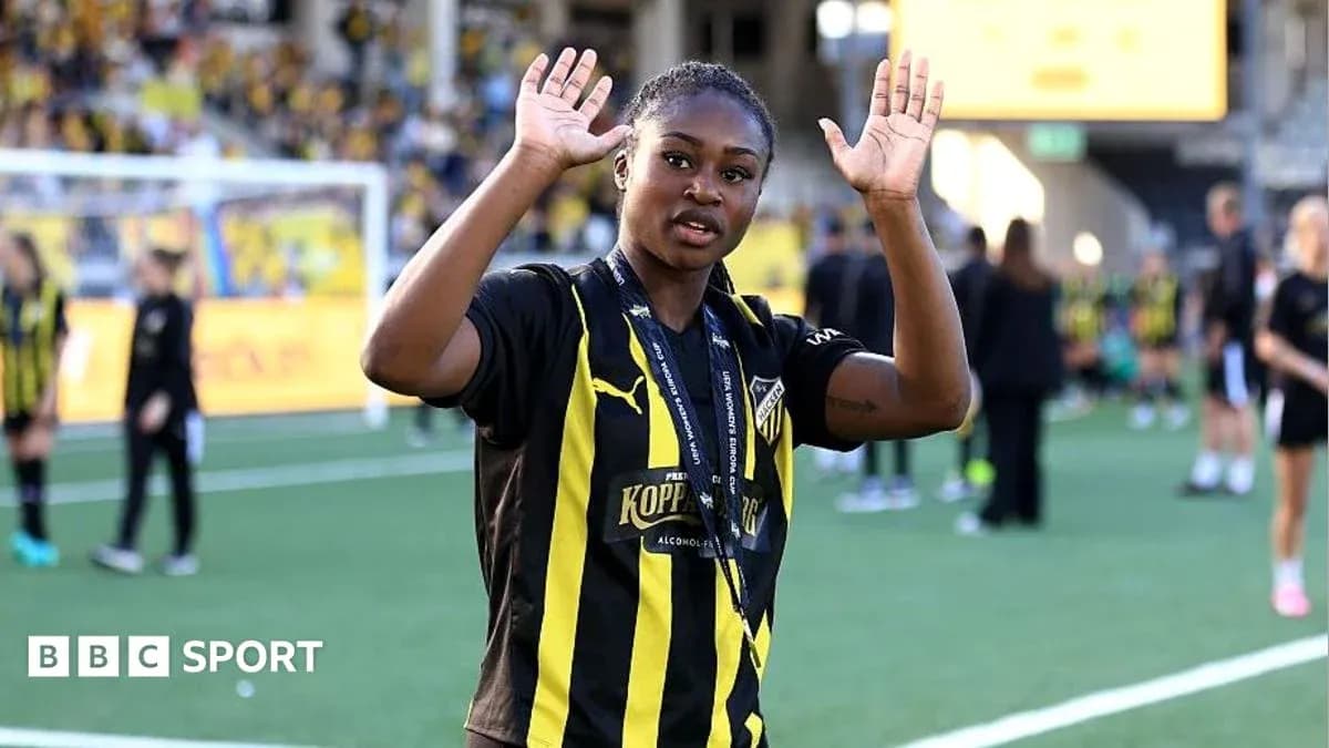 Player waving with hands on the pitch