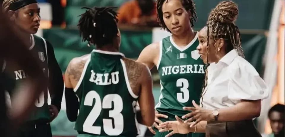 Coach discussing strategy with Nigeria basketball players