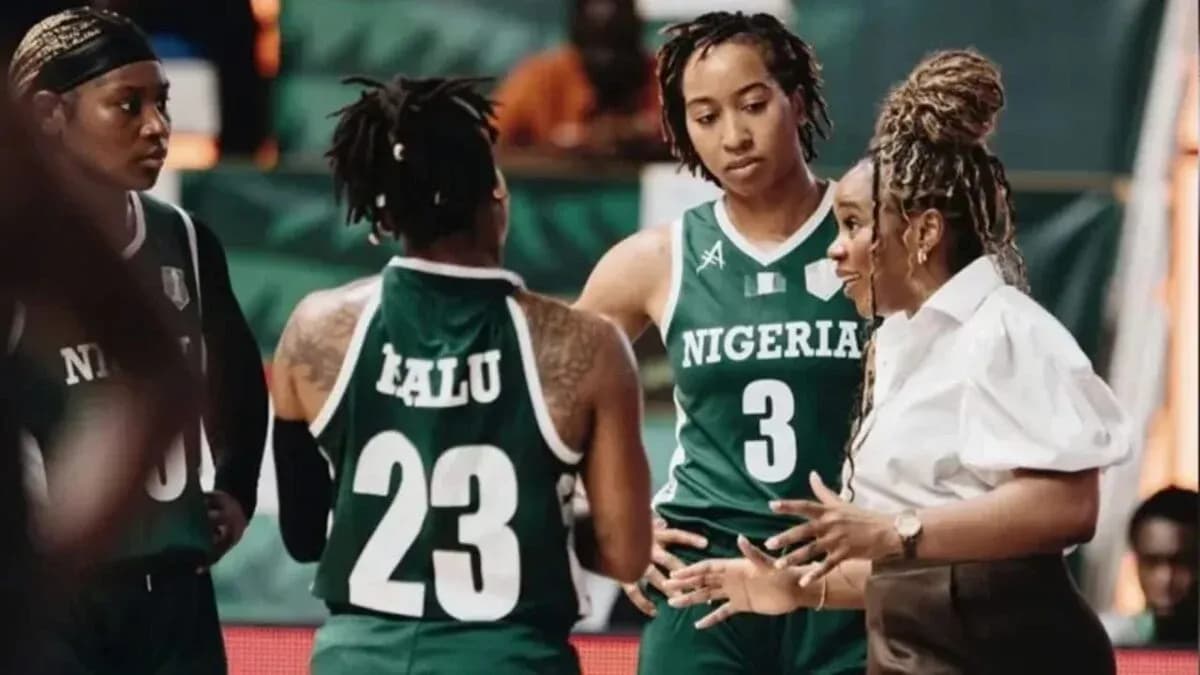 Coach discussing strategy with Nigeria basketball players