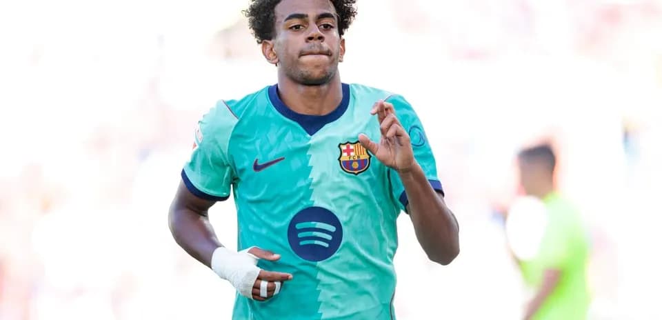 Player in Barcelona jersey celebrating on the field