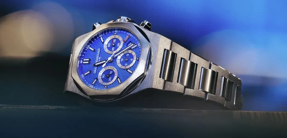 Luxury watch with blue dial and stainless steel band