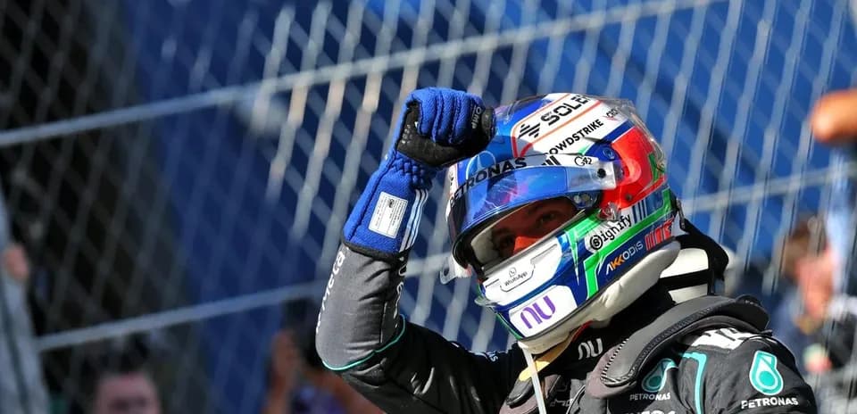 Driver celebrating after a race with fist raised
