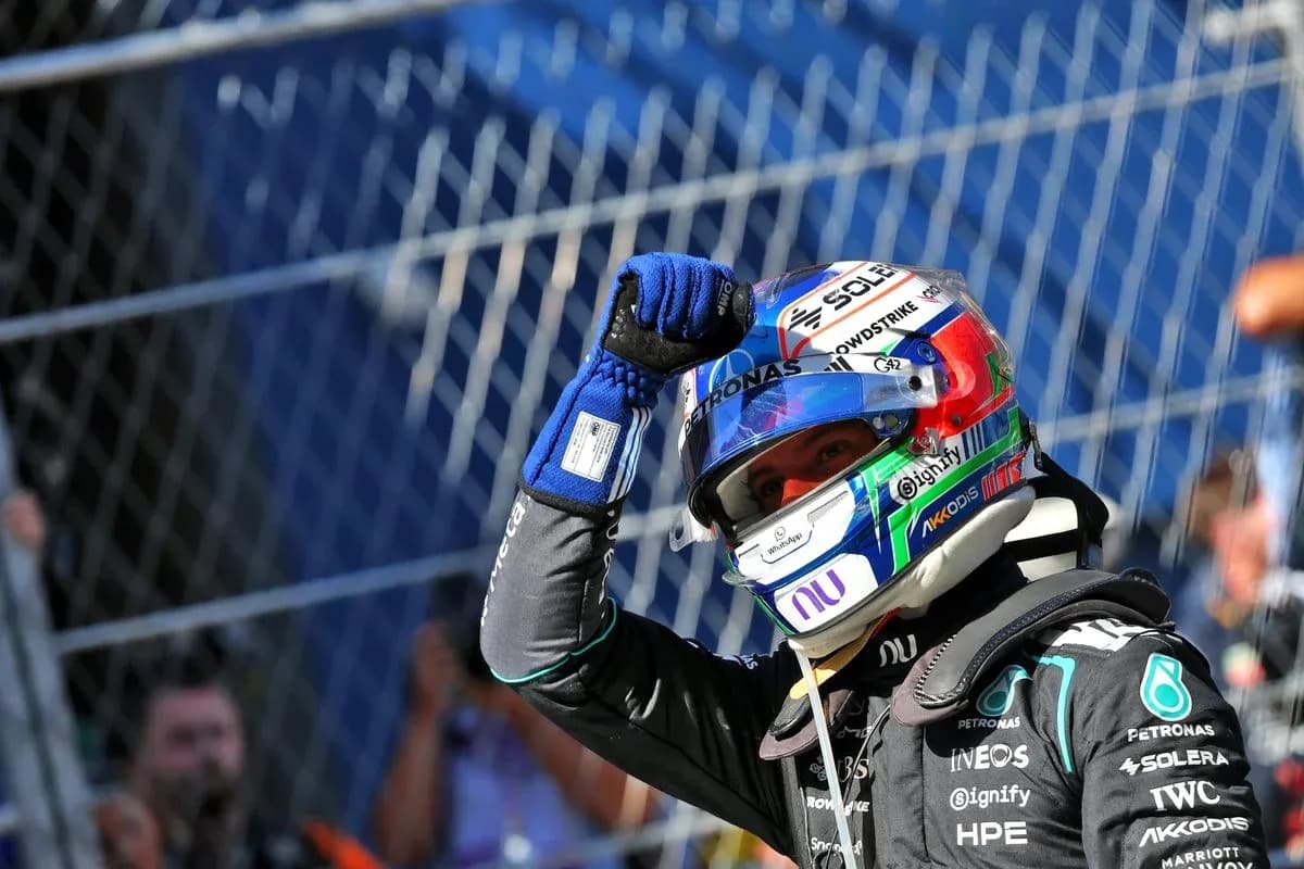 Driver celebrating after a race with fist raised