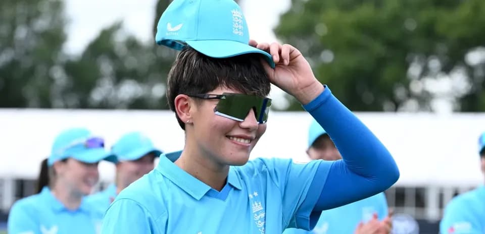 Player adjusting cap during team warm-up session